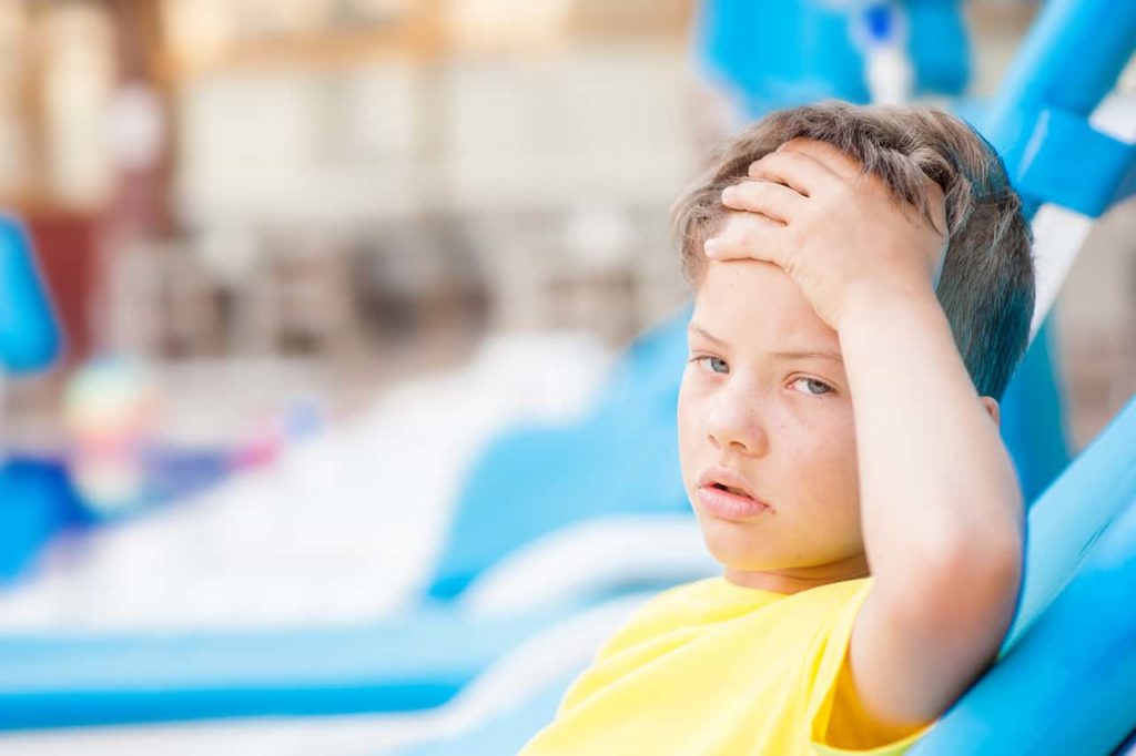 child experiencing heat stroke at a pool