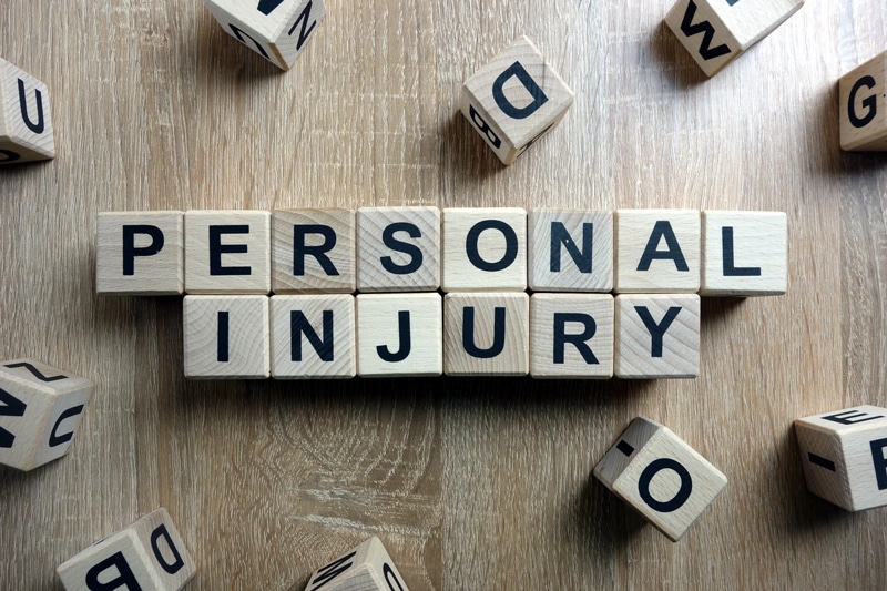 boston personal injury attorney blocks spell out personal injury on a desk